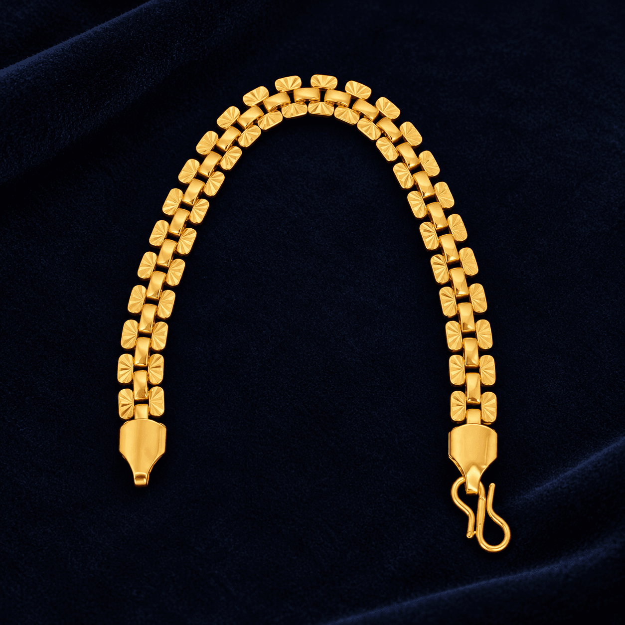 Gold-tone bracelet with textured rectangular links and hook clasp
