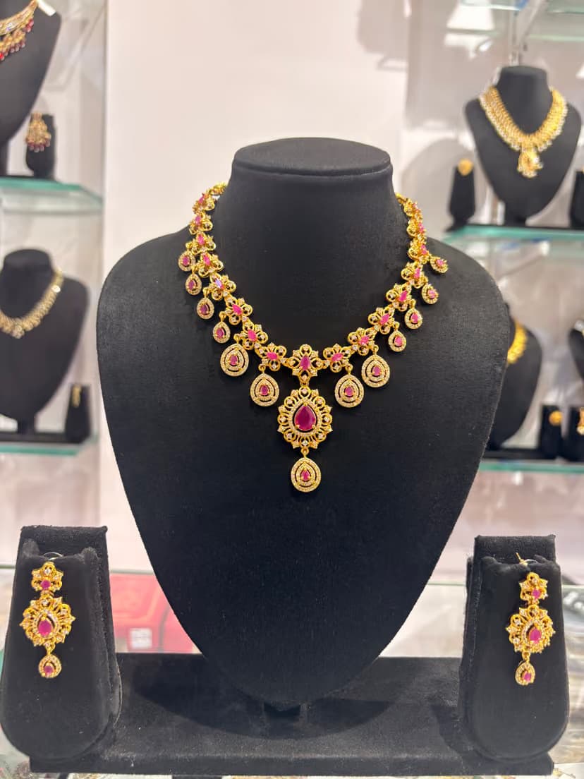 Gold-tone Necklace with Pink Teardrop Accents and Matching Earrings