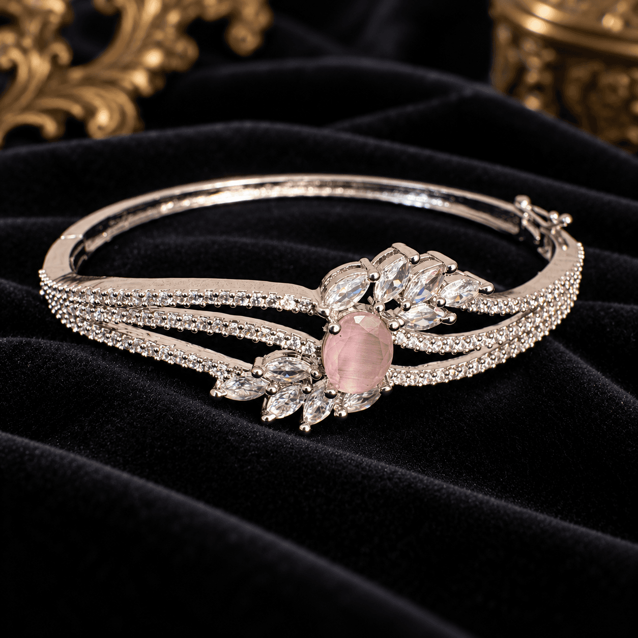 Silver-toned bracelet with clear accents and a pink oval centre detail